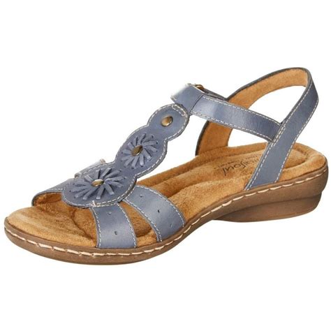 Comfort in paradise. Womens sandals made for every resort, beach, poolside, and sunny summer moment. Faux leather with a stretch gore strap, round open toe, slip-on fit, and heel sling strap. Linings and insole board partially crafted with recycled materials. Soft System® comfort package provides all-day support, flex, and cushioning. Traction sole provides …